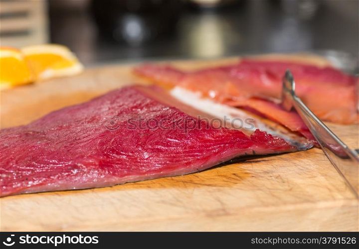 Fresh smoked salmon cut into thin slices