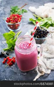 fresh smoothie with fresh berries on a table