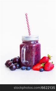 Fresh smoothy berry drink in glass jars with igredients. Fresh smoothy berry drink