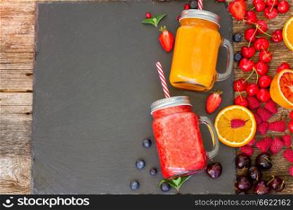 Fresh smoothy citrus and berry drinks with igredients and copy space. Fresh smoothy drink with igredients
