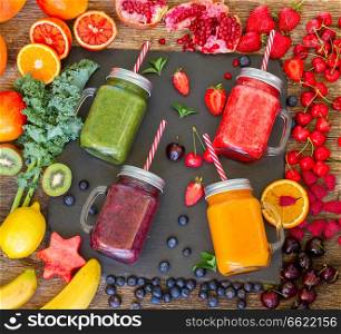 Fresh smoothy drinks in glass jars with igredients. Fresh smoothy drink with igredients