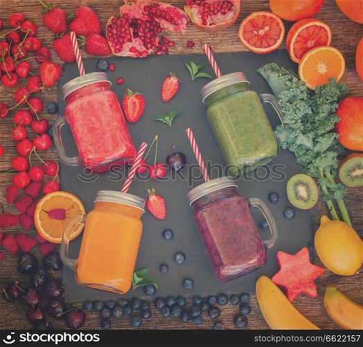 Fresh smoothy drinks in glass jars with igredients, retro toned. Fresh smoothy drink with igredients