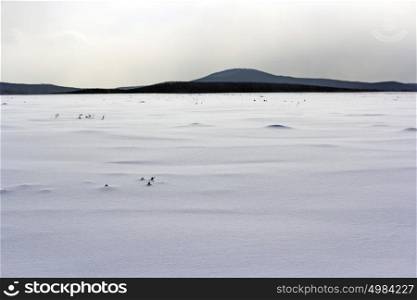 Fresh snow cover in dunes at closeup, a winter landscape