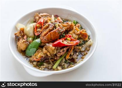 Fresh soft crabs cooked in black pepper sauce on white background