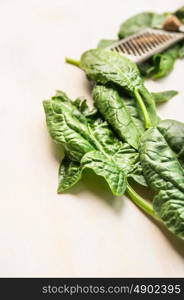 Fresh spinach leaves on white wooden background, close up