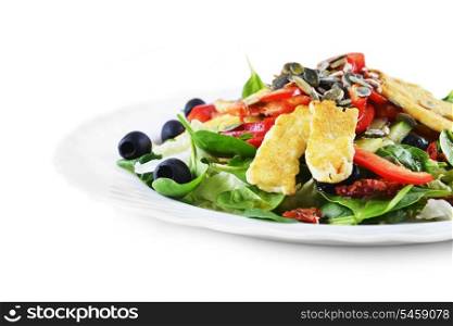 Fresh spinach salad with goat cheese and seeds
