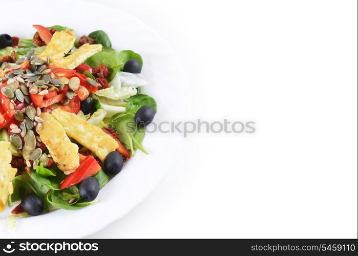 Fresh spinach salad with goat cheese and seeds