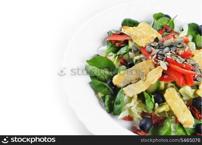 Fresh spinach salad with goat cheese and seeds