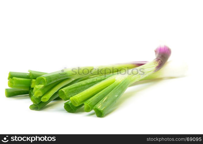 Fresh spring onions isolated over white background