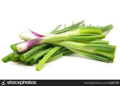 Fresh spring onions isolated over white background