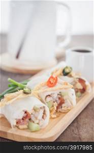 Fresh spring rolls on wooden table, stock photo