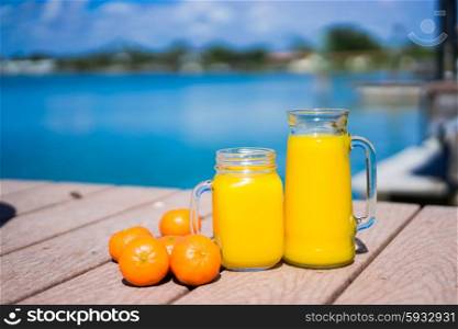 Fresh squizzed orange juice near the ocean