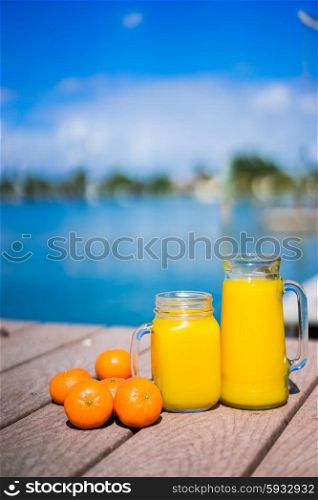 Fresh squizzed orange juice near the ocean
