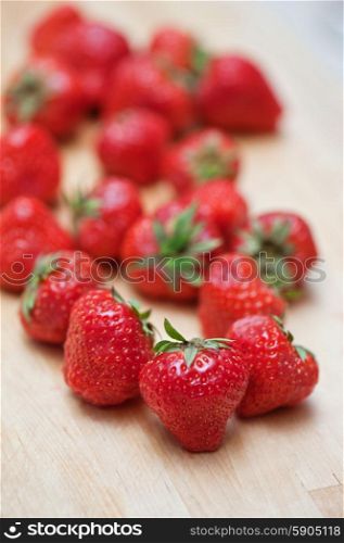 Fresh strawberries. Fresh strawberries at wooden background