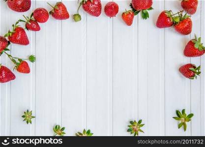 Fresh strawberries in a bowl on a white background. Top viewpoint.. Fresh strawberries in a bowl on a white background.