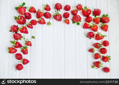 Fresh strawberries in a bowl on a white background. Top viewpoint.. Fresh strawberries in a bowl on a white background.