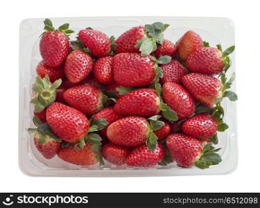 Fresh strawberries in a plastic container isolated on white background. Fresh strawberries in a plastic container