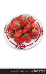 Fresh strawberries in plate over white background
