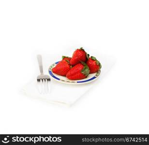 fresh strawberries on little dish isolated over white