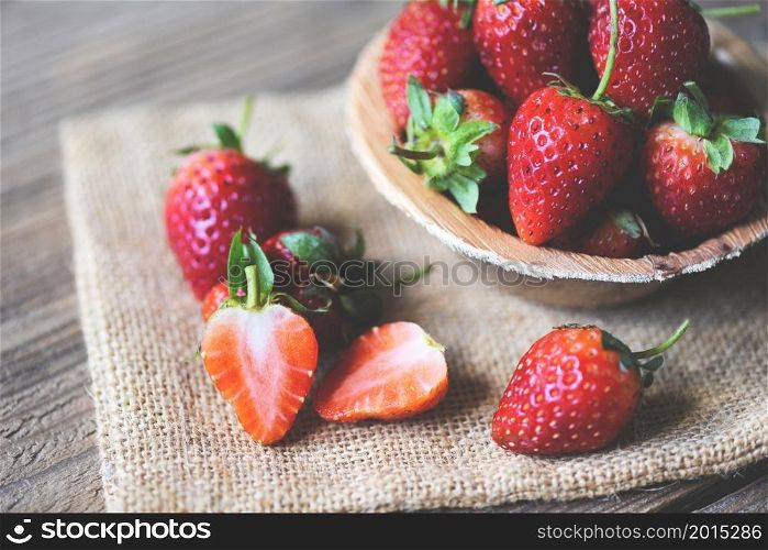 Fresh strawberries on sack, Red ripe strawberry on wooden background