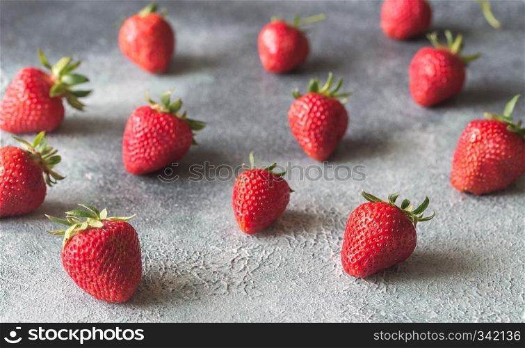 Fresh strawberries on the gray background