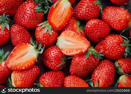 Fresh strawberries, top view of ripe berries. Background of ripe strawberries, delicious natural dessert
