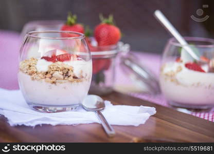 Fresh strawberries with yoghurt at breakfast