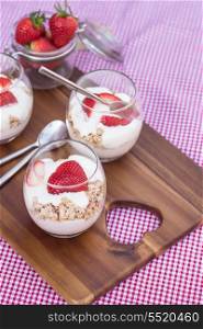 Fresh strawberries with yoghurt at breakfast