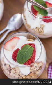 Fresh strawberries with yoghurt at breakfast