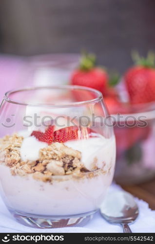 Fresh strawberries with yoghurt at breakfast