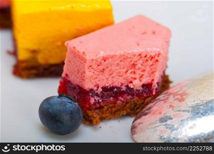 fresh strawberry and mango mousse dessert cake with blueberry