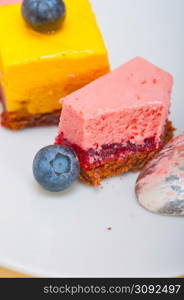 fresh strawberry and mango mousse dessert cake with blueberry