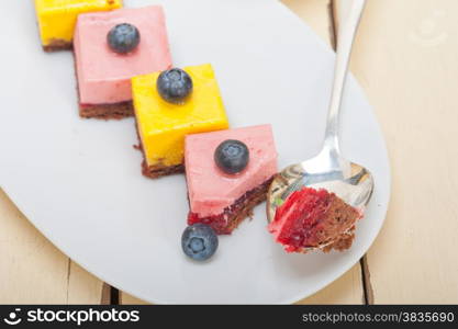 fresh strawberry and mango mousse dessert cake with blueberry