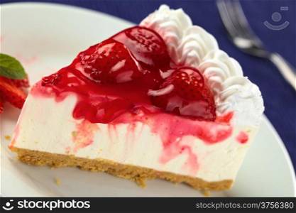 Fresh strawberry cheesecake (Selective Focus, Focus on the glazing running down on the left and the left side of the two strawberries in the front). Strawberry Cheesecake