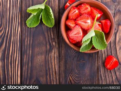 fresh strawberry on plate and on a table
