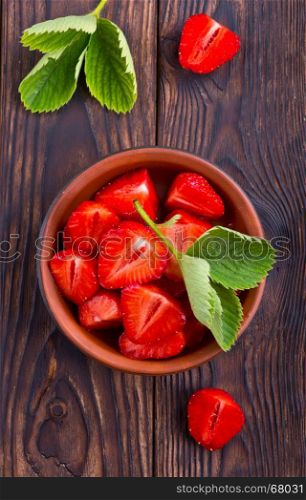 fresh strawberry on plate and on a table