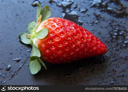 Fresh strawberry. Red strawberry on dark background