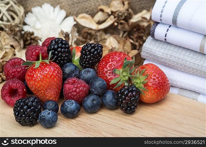 Fresh Summer berries in rustic kitchen setting