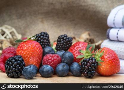 Fresh Summer berries in rustic kitchen setting