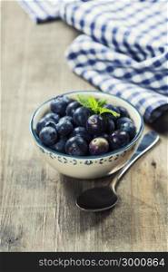 Fresh summer Blueberries on wooden background