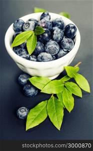 Fresh summer Blueberries on wooden background