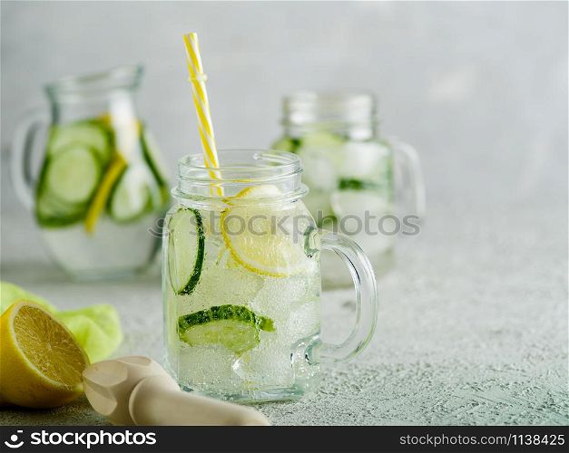 Fresh Summer Drink. Healthy detox fizzy lemonade with lemon and cucumber in mason jar. Healthy food concept. Detox diet.