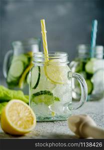 Fresh Summer Drink. Healthy detox fizzy lemonade with lemon and cucumber in mason jar. Healthy food concept. Detox diet.