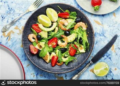 Fresh summer salad with prawn,strawberry,avocado,lime and olive.Summer salad,healthy eating. Summer salad with shrimps and strawberries