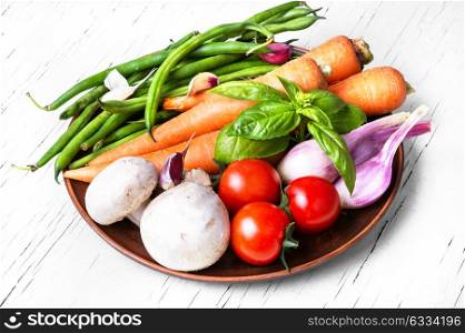 fresh summer vegetables. set of vegetables from mushrooms, tomato, garlic, peas and basil