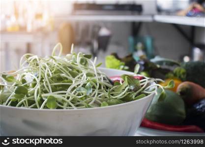 Fresh sunflower sprouts in kitchen,Vegetable salad, Healthy food