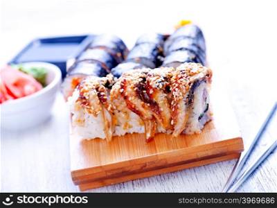 fresh sushi on tray and on a table