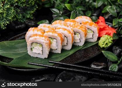 Fresh sushi rolls with shrimp on stone plate
