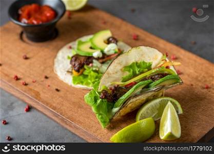 fresh taco with avocado on cutting board