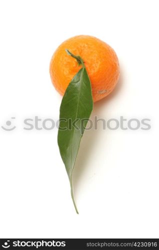 fresh tangerine with green leaf isolated on white background